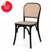 Café chair with black wooden frame and a rattan seat and back.