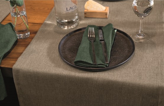 Table setting in Restaurant with Grey Runner and Green Napkin.